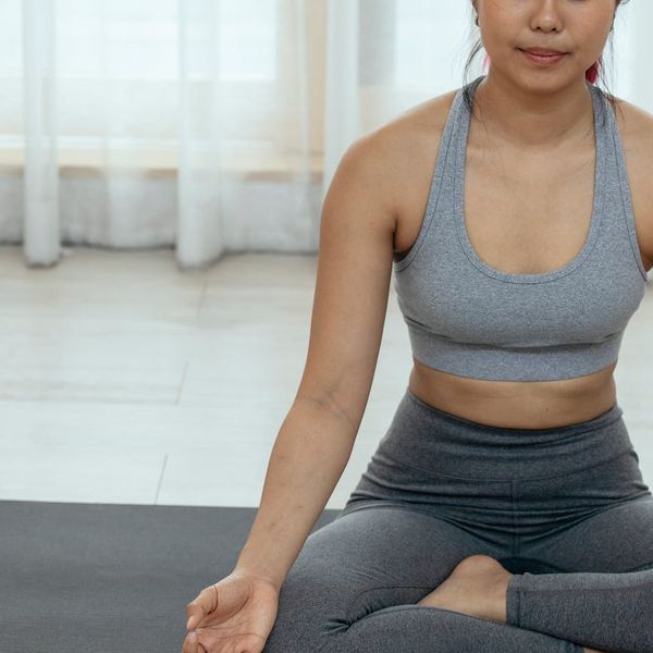 Close-up of a yoga mat corner in a tranquil setting.